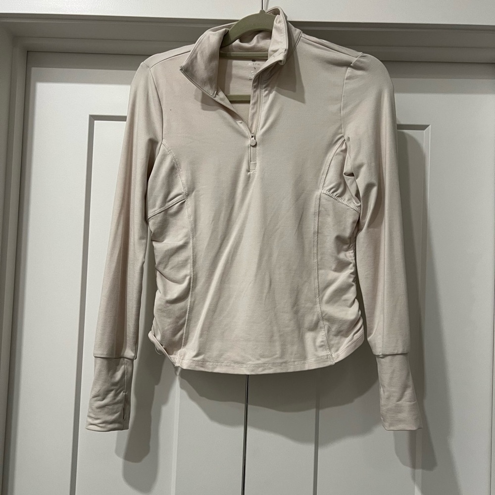 Fitted cream colored quaterzip